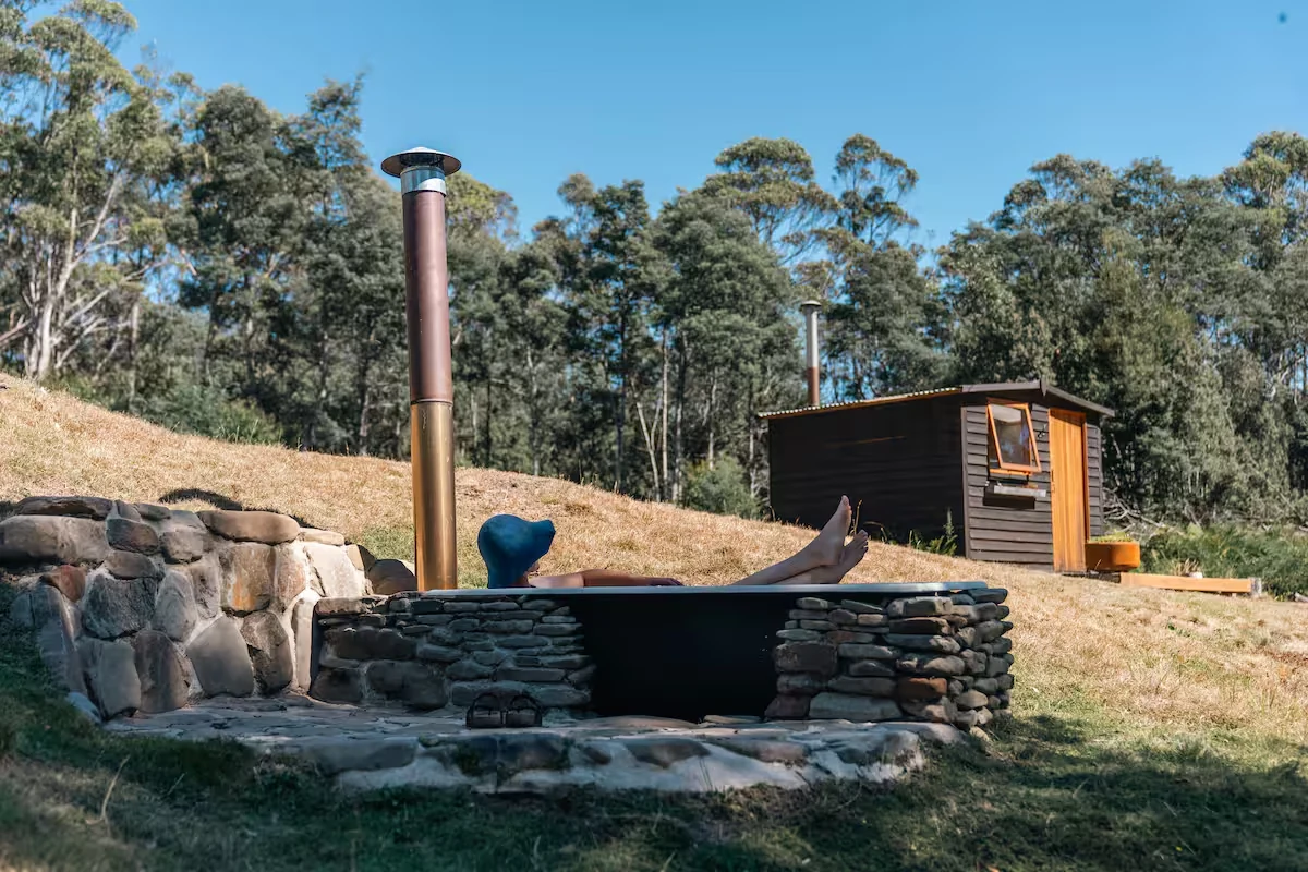 Wood-fired outdoor bath beside the cabin